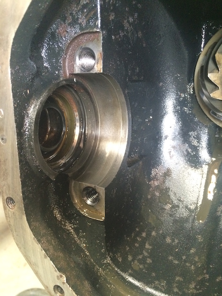 1981 Ford Bronco - This is a close-up view of the inside of a differential housing, showing a bearing race and part of a gear. The housing appears to be made…