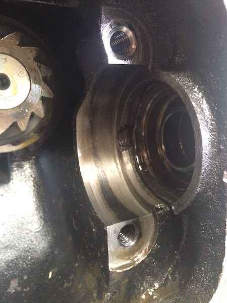 1981 Ford Bronco - This close-up image shows the interior of a mechanical component, likely part of a vehicle's drivetrain. Visible are gears, threaded holes…