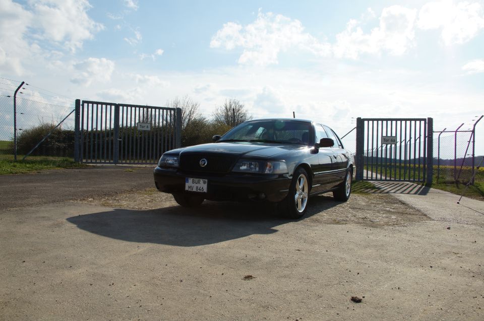 Black 2003 Mercury Marauder parked in front of a gate