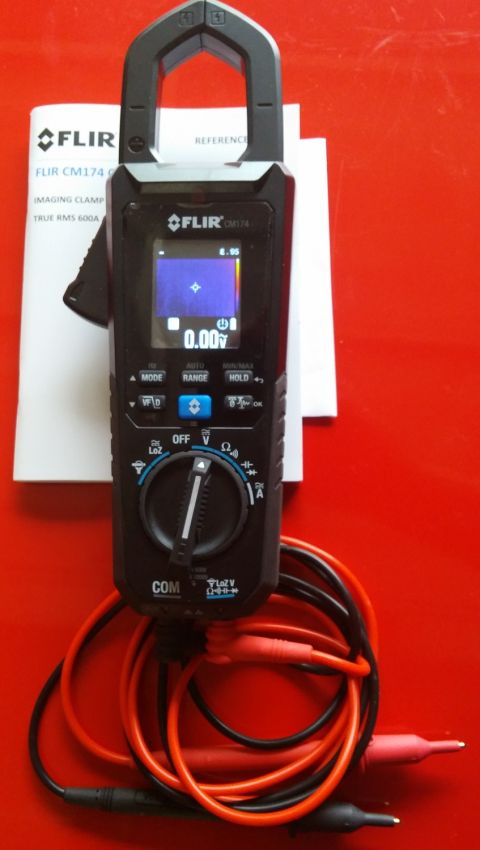 2000 Ford Crown Victoria - A FLIR CM174 imaging clamp meter is shown with its accessories on a red background.