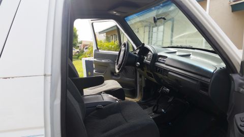 1992 Ford Bronco - Interior view of a 1992 Ford Bronco, showing the dashboard, seats, and steering wheel.