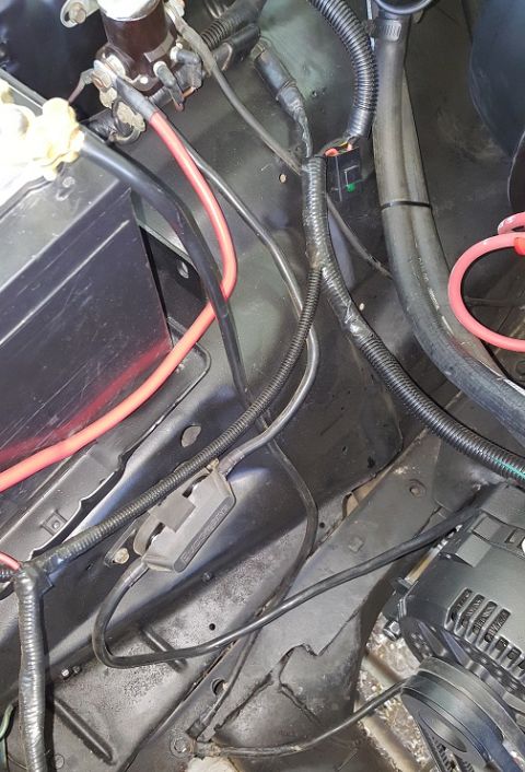 1978 Ford Bronco - Close-up view of the engine bay, focusing on the electrical wiring and components.