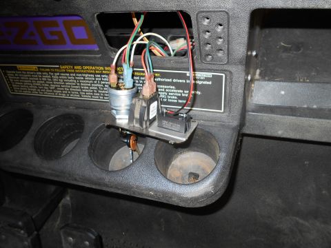 1992 Ford Bronco - Close-up of a golf cart's interior dashboard, showing the ignition switch and wiring harness.