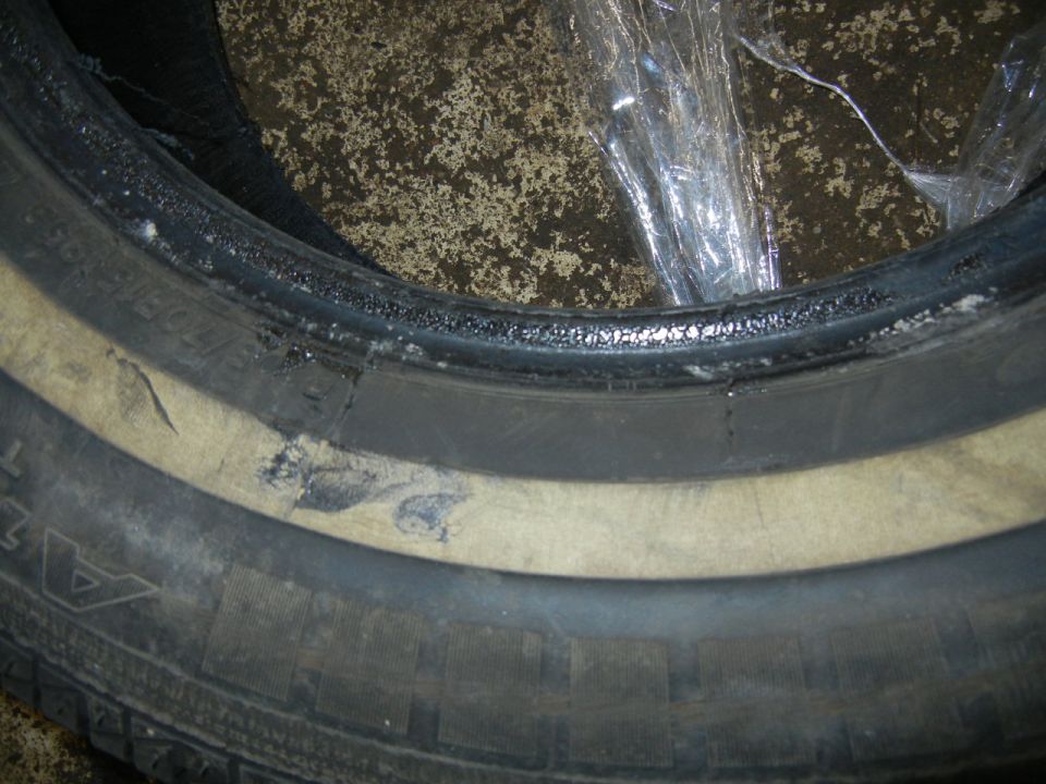Used tire purchased from and installed by Tires and More for Less in NE Minneapolis on 03May2016, pic06.  Upon returning my flat tire to the used tire store on 05May2016 and being taken on a tour through the shop by the owner, I saw a mechanic quickly take the flat tire off the rim and place it onto the floor.  I stepped over and took photos.  I clearly saw there was a fresh tar-like goo(?) around the entire bead on both sides of the tire, with some goo smeared onto the sidewall and rim.  I'd never before seen a goo like this on a tire bead.  I assume the tire shop uses it to help seal the tire, but they never responded to my questions about the goo.