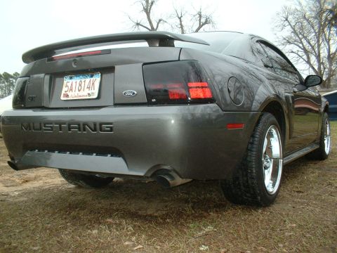2003 Ford Mustang - This 2003 Ford Mustang is shown from the rear with its distinctive taillights and spoiler.