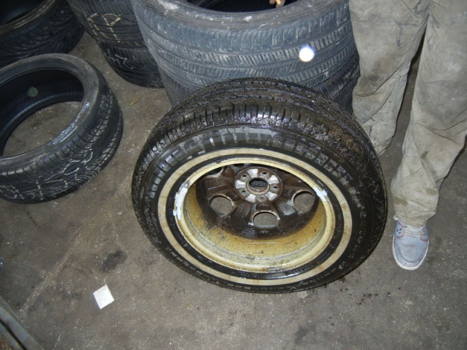 Used tire purchased from and installed by Tires and More for Less in NE Minneapolis on 03May2016, pic09.  After the mechanics saw my flat tire on 05May2016, they quickly offered to replace it with an identical used tire.  I said OK, but realizing that both beads were damaged on the flat tire, and that one sidewall was damaged, and a tar-like goo was smeared around both tire beads, I advised that I also needed to have the other three wheels removed from my car so the tires could be deflated to allow me to inspect the beads for damage on all four tires before reinflation.  They told me to go to the waiting room.  I did briefly go up front, but quickly returned to the garage to find they'd already inflated the replacement used tire (mechanic shown in photo with replaced tire), so I was unable to inspect the bead for damage which might be caused by an untrained mechanic.  They did not seem to care, and they repeatedly told me to trust them.  I repeatedly told them I did not trust them.  They repeatedly asked me what I wanted, and I repeatedly told them I needed to inspect all the beads prior to tire inflation.  They did not show any interest in removing the other wheels from my car, but they did show interest in getting this wheel back onto my car and getting me out the door.  I told them I needed to buy new tires and return these, but they only offered a partial refund, which I turned down.  I left, with the factory spare tire still mounted and the inflated replacement tire in the trunk, went to a major-brand store and bought four new tires, and returned these four used tires the same day without getting a refund.