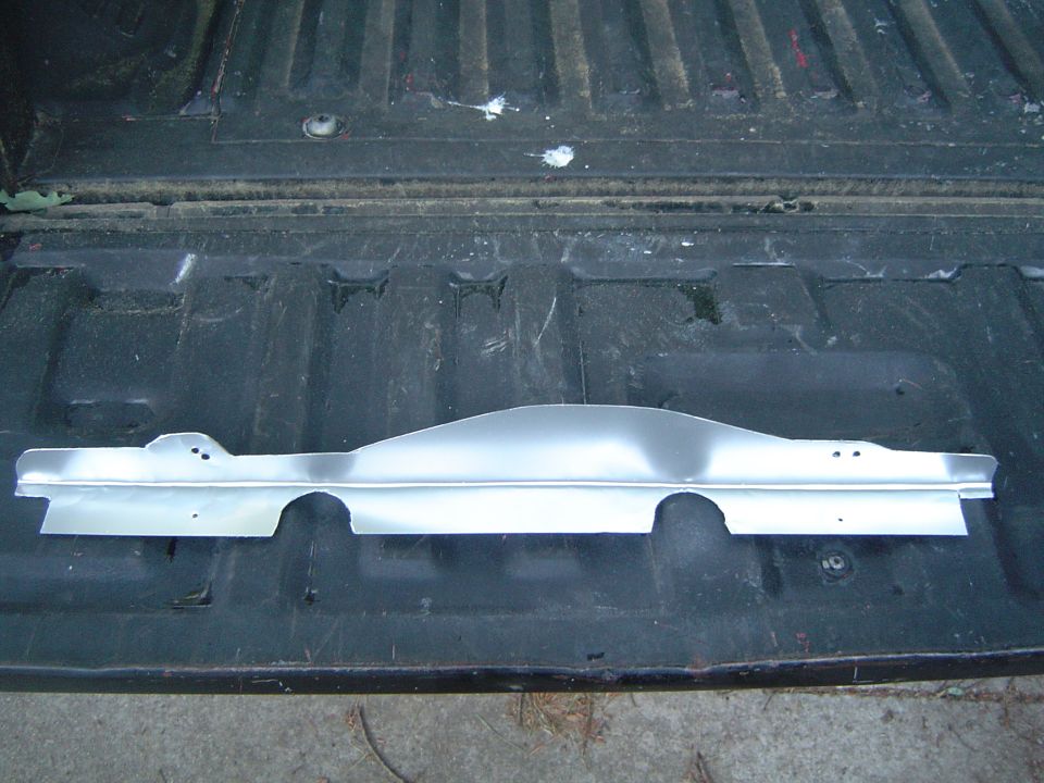 I cut out and shaped this simple gap filler from a piece of scrap sheet metal. (Painted with aluminum paint)