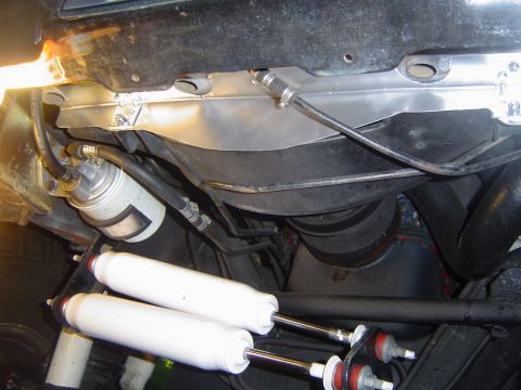 1986 Ford Bronco - Gap filler in place. It attaches to the lower core support with six sheet metal screws and to the fan shroud with two 1/4" bolts with…