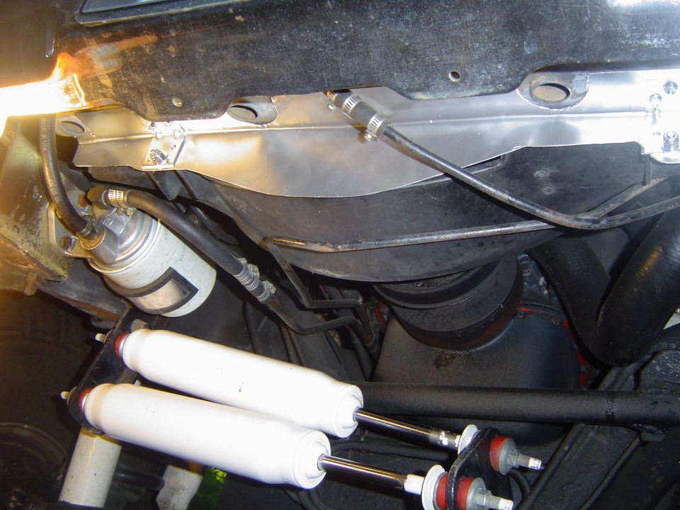 Gap filler in place. It attaches to the lower core support with six sheet metal screws and to the fan shroud with two 1/4" bolts with nyloc nuts. There is still a small gap where the notch is in the shroud, I will fill this and the two notches on the side of the shroud at a later date.