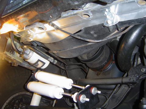 1986 Ford Bronco - Gap filler in place. It attaches to the lower core support with six sheet metal screws and to the fan shroud with two 1/4" bolts with…