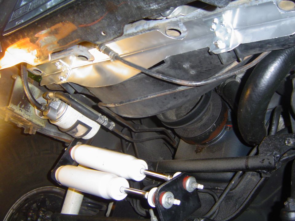 Gap filler in place. It attaches to the lower core support with six sheet metal screws and to the fan shroud with two 1/4" bolts with nyloc nuts. There is still a small gap where the notch is in the shroud, I will fill this and the two notches on the side of the shroud at a later date.