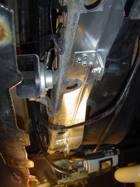 1986 Ford Bronco - Gap filler in place. It attaches to the lower core support with six sheet metal screws and to the fan shroud with two 1/4" bolts with…