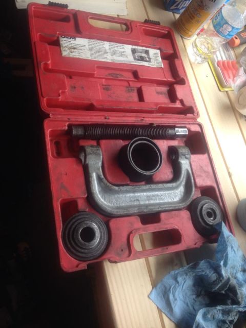 1990 Ford Bronco - A ball joint press tool kit is shown inside its red plastic case, ready for use.