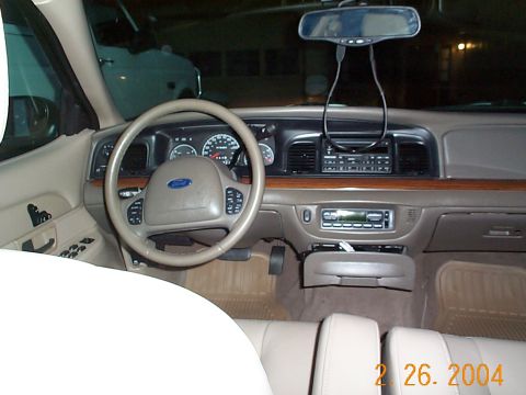 2003 Ford Crown Victoria - Dashboard and interior of a 2003 Ford Crown Victoria, showing the steering wheel and center console.