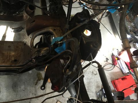 1987 Ford Bronco - Underside view of engine bay components, showing hoses, wiring, and structural elements.