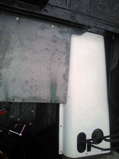 1991 Ford Bronco - Close-up view of interior paneling and metal sheeting, the Supermotors.net logo at the bottom.
