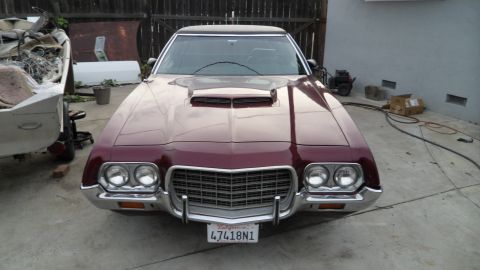 1972 Ford Ranchero - Front view of a 1972 Ford Ranchero, a prominent grille and hood scoop.