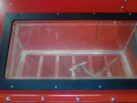 1990 Ford Bronco - Sandblaster cabinet interior view showing the spray gun and grate.