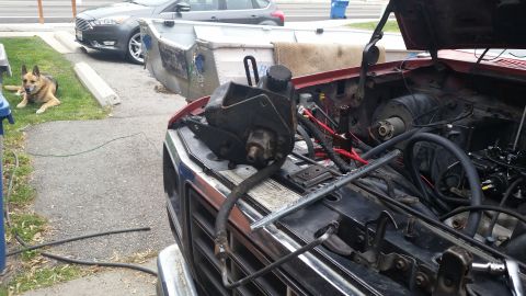1981 Ford Bronco - The engine bay of a 1981 Ford Bronco shows the power steering pump removed for service.