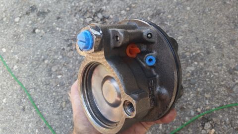 1981 Ford Bronco - Close-up of a power steering pump, likely for an older vehicle.