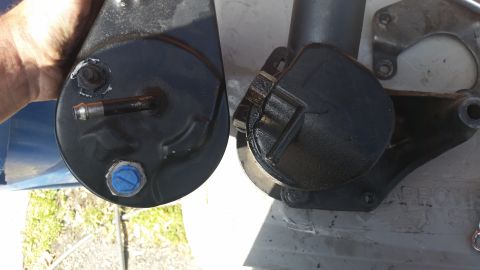 1981 Ford Bronco - A close-up view shows two power steering pumps, possibly for comparison or replacement.