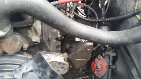 1981 Ford Bronco - This image shows various engine components, including hoses, wiring, and mounting brackets, with a Supermotors logo visible.