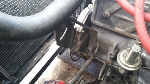 1981 Ford Bronco - Close-up view of engine components, including a radiator hose and part of the engine block.