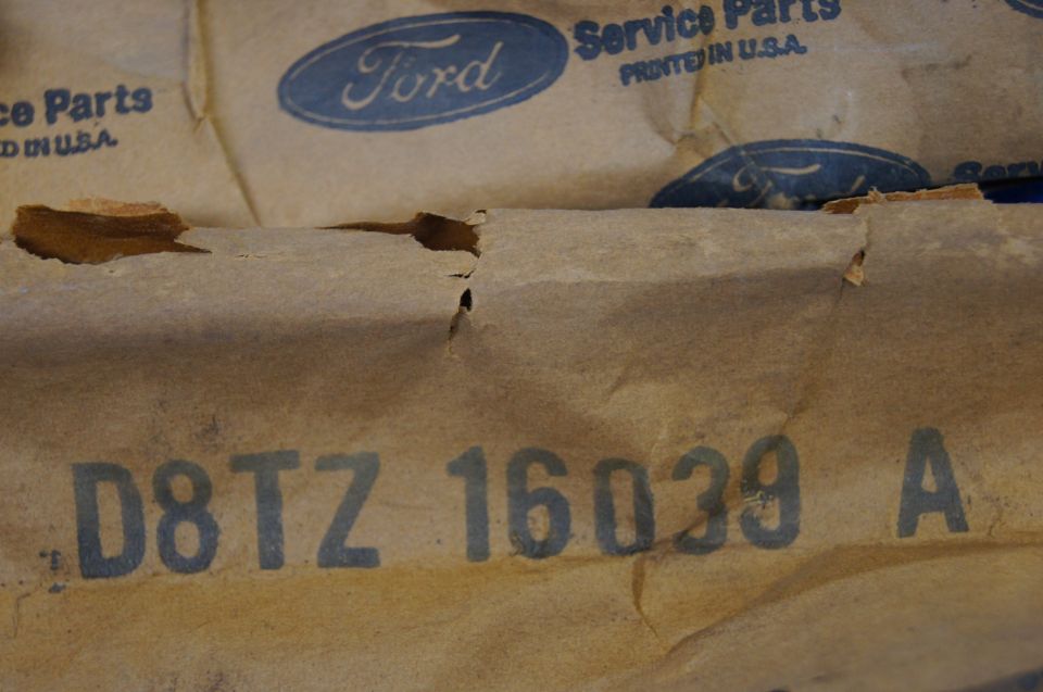 Ford service parts packaging with part number D8TZ 16039 A stamped on it
