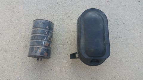 1992 Ford Bronco - Two automotive parts, possibly related to vacuum systems, are shown on concrete.