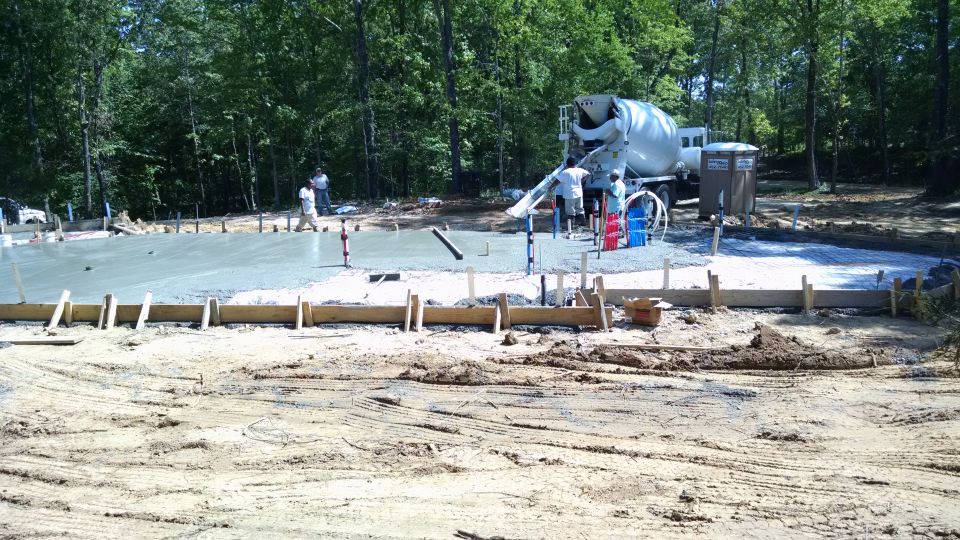 Between rain storms, the slab was poured Sat, May 7.