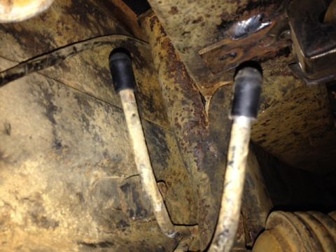 1973 Ford Bronco - Rusted frame and brake lines, likely from an older vehicle.