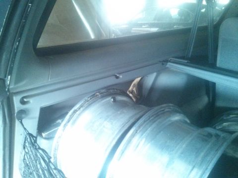 1995 Ford Bronco - Interior view of a vehicle's cargo area, showing spare tires and a cargo net.