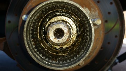 1992 Ford Bronco - This photo shows a close-up view of a vehicle's locking hub assembly, which appears to be covered in grease.