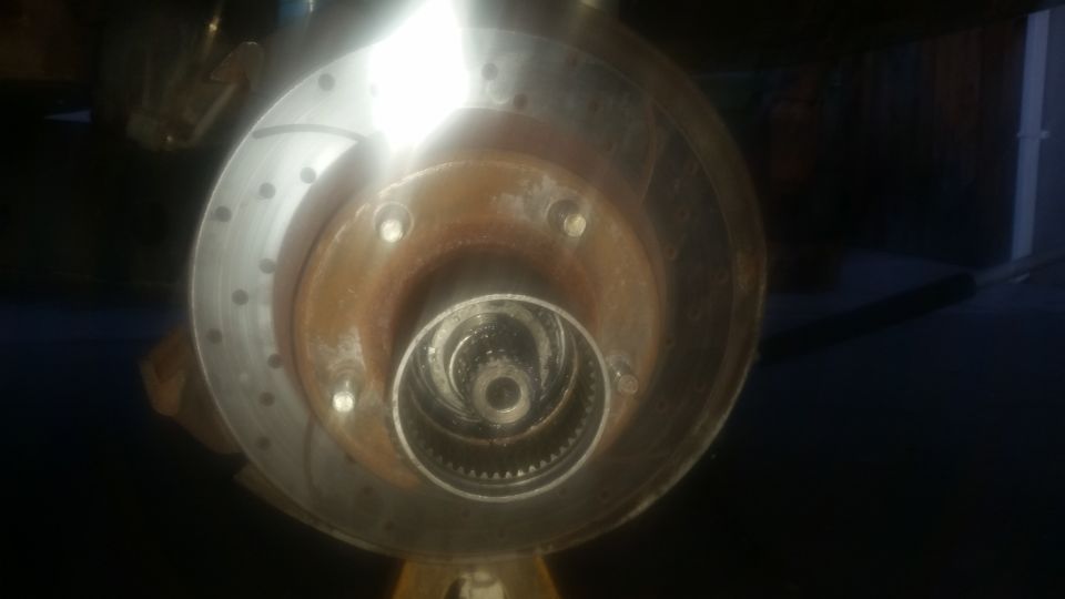 close-up of vehicle wheel hub and brake rotor