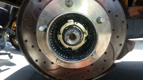 1992 Ford Bronco - A vehicle's locking hub and brake rotor assembly is shown in detail.