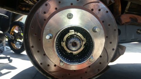 1992 Ford Bronco - Close-up view of a vehicle's front wheel hub and brake rotor assembly.