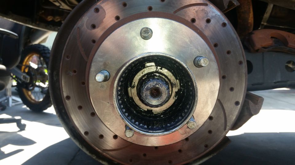 Front wheel hub and brake rotor assembly