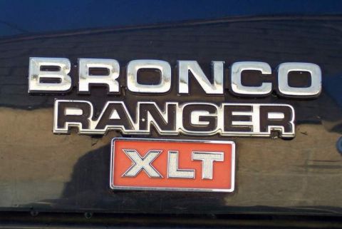 1978 Ford Bronco - Close-up of a Bronco Ranger XLT emblem, indicating a specific trim level.