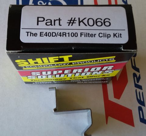 1996 Ford Bronco - A transmission filter clip kit is shown with its packaging and a loose metal clip.