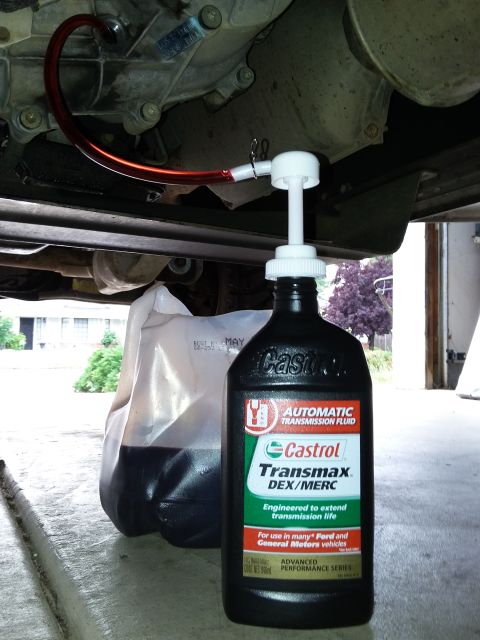 1996 Ford Bronco - Adding automatic transmission fluid to a vehicle using a pump and Castrol Transmax fluid.
