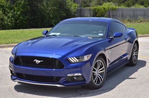 2015 Ford Mustang - Blue 2015 Ford Mustang coupe with a black grille and silver wheels.