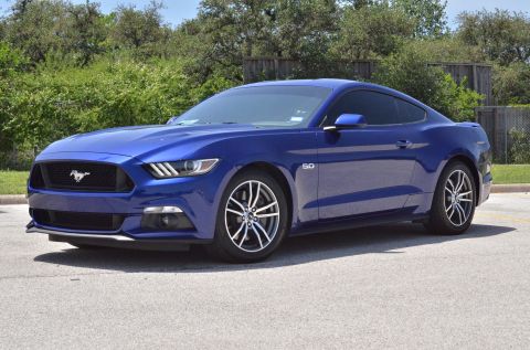 2015 Ford Mustang - Blue 2015 Ford Mustang coupe with a black grille and '50' badging on the fender.