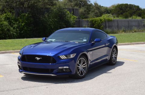 2015 Ford Mustang - Front 3/4 view of a blue 2015 Ford Mustang coupe.