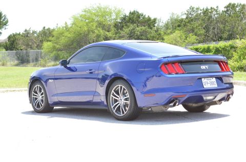 2015 Ford Mustang - Rear view of a blue 2015 Ford Mustang GT coupe parked outdoors.