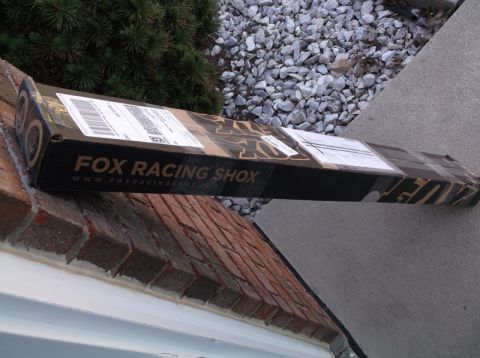 2005 Ford F-150 - A box for Fox Racing Shox is placed on a brick ledge next to gravel and concrete.