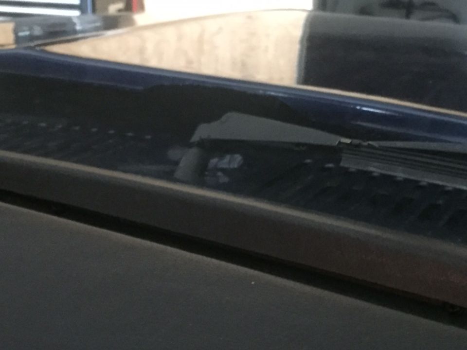 Close-up of windshield wiper and cowl area