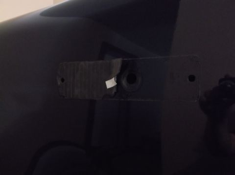 2005 Ford F-150 - The rear bumper mounting bracket on a black Ford F-150 shows signs of wear and tear.