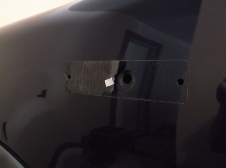 Removed emblem area on dark 2005 Ford F-150 fender