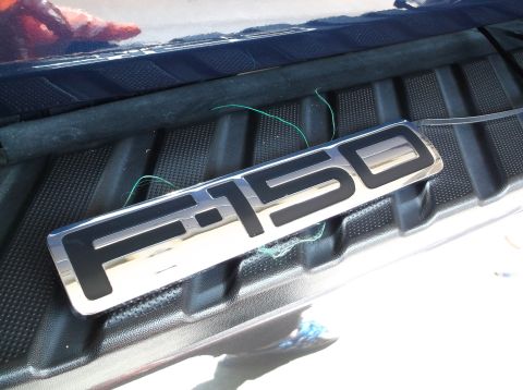 2005 Ford F-150 - F-150 emblem is shown in the bed of a truck.