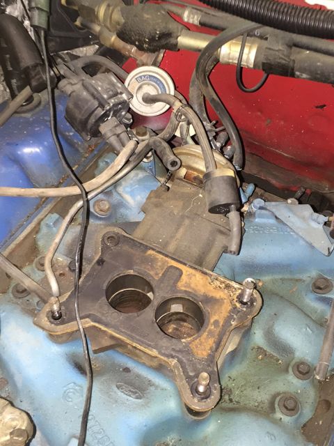 1978 Ford Bronco - Engine bay view of a carburetor and distributor assembly on a Ford V8.